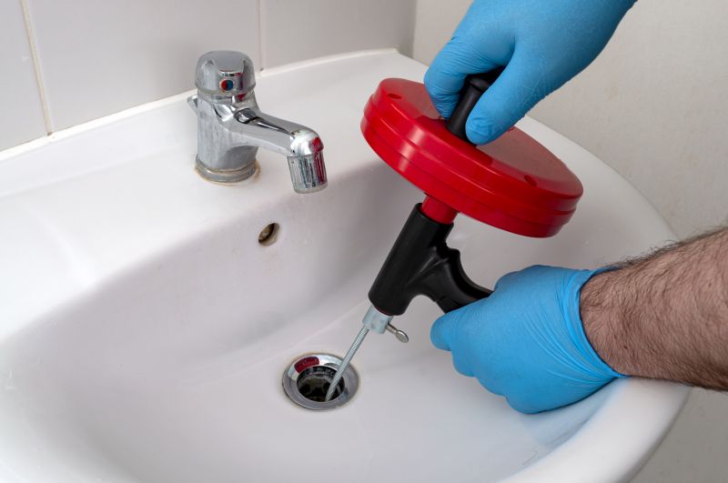 Plumber Fixing a Sink